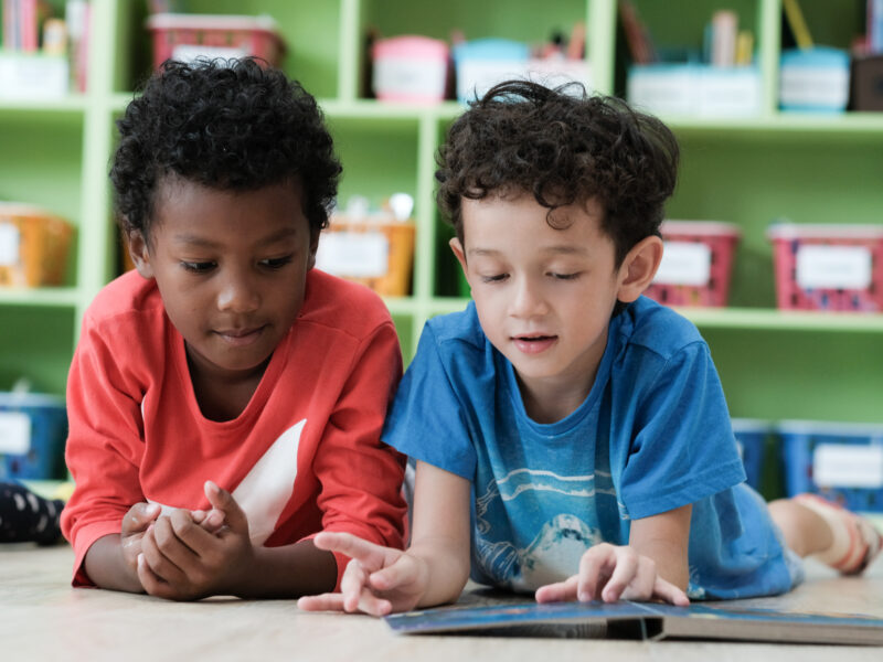 Two elementary school students working together to improve on their challenges in self-monitoring.