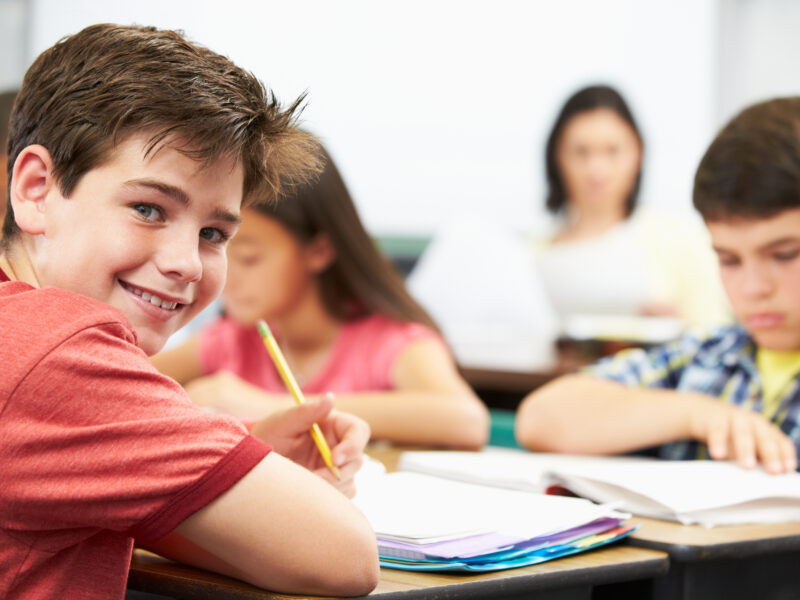 This middle school boy is developing emotional control skills in class.